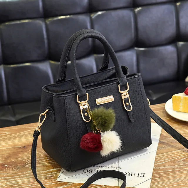 Structured Pebbled Leather Top-Handle Tote Bag with Pom-Pom Charm & Crossbody Strap