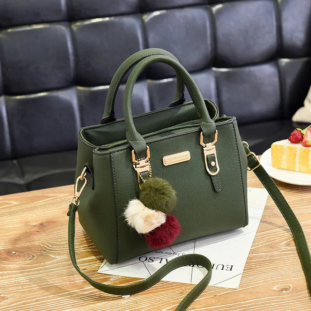 Structured Pebbled Leather Top-Handle Tote Bag with Pom-Pom Charm & Crossbody Strap