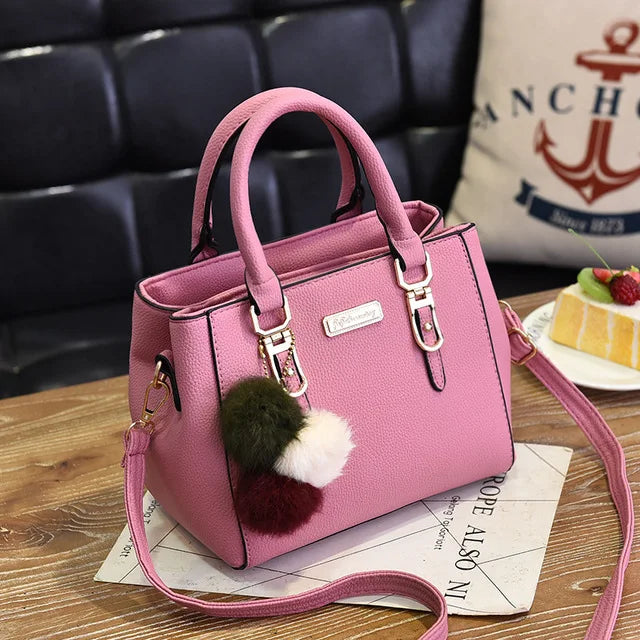 Structured Pebbled Leather Top-Handle Tote Bag with Pom-Pom Charm & Crossbody Strap