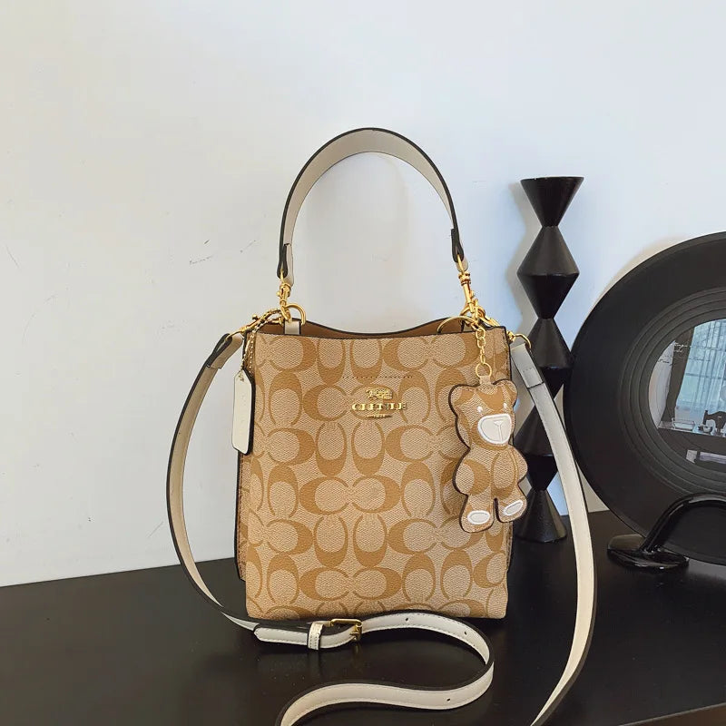 CLENLE Women's Vintage Monogram Bucket Bag – Signature Canvas Shoulder Tote & Crossbody Handbag with Bear Charm