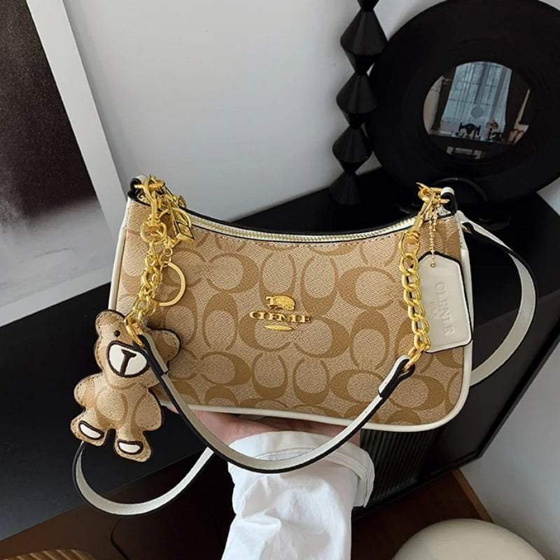 CLENLE Women's Vintage Monogram Shoulder Bag – Classic Canvas Crossbody Bag with Matching Bear Charm & Gold-Tone Chain