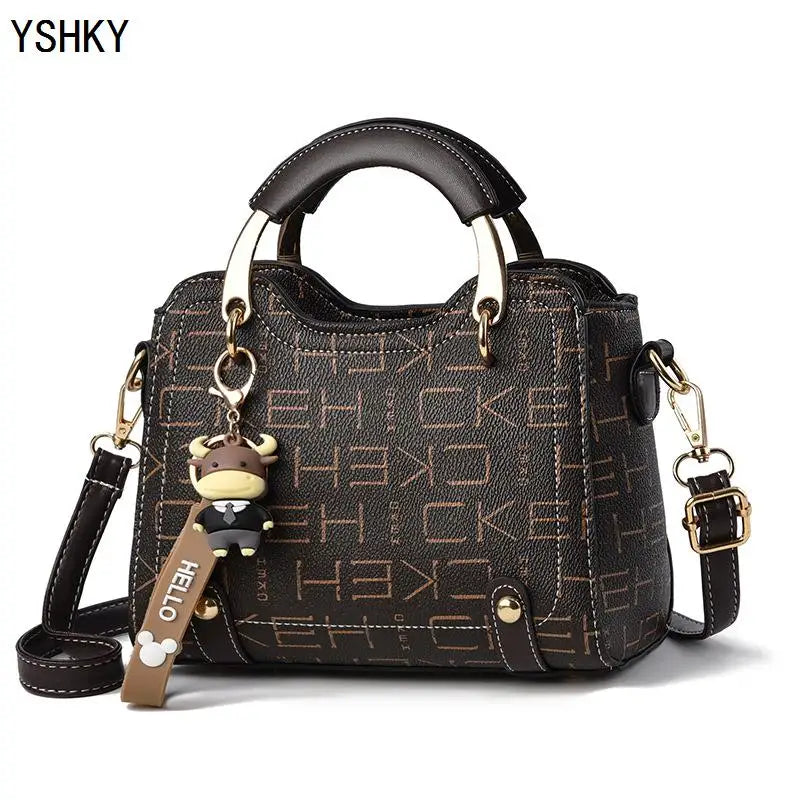 Women's PU Leather Handbag - Small Crossbody Purse with Cute Cow Charm & Multi-Pocket Interior - YSHKY
