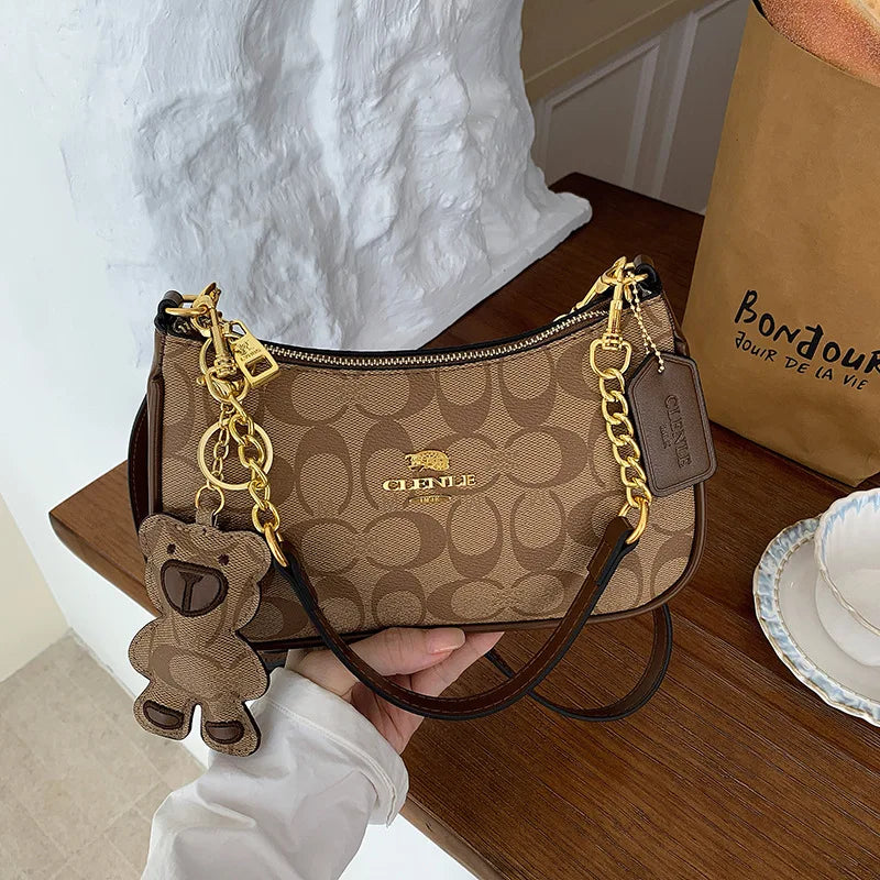 CLENLE Women's Vintage Monogram Shoulder Bag – Classic Canvas Crossbody Bag with Matching Bear Charm & Gold-Tone Chain