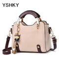 Women's PU Leather Handbag - Small Crossbody Purse with Cute Cow Charm & Multi-Pocket Interior - YSHKY