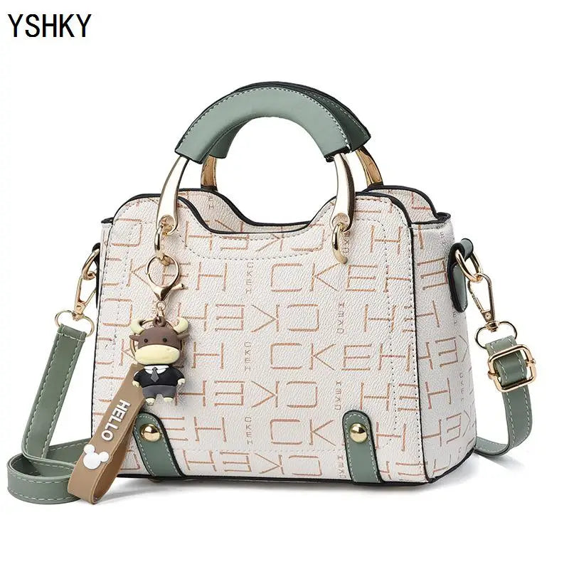 Women's PU Leather Handbag - Small Crossbody Purse with Cute Cow Charm & Multi-Pocket Interior - YSHKY