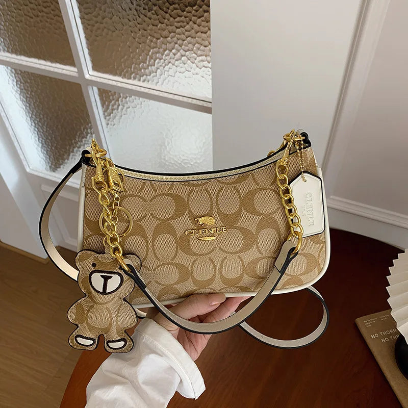 CLENLE Women's Vintage Monogram Shoulder Bag – Classic Canvas Crossbody Bag with Matching Bear Charm & Gold-Tone Chain