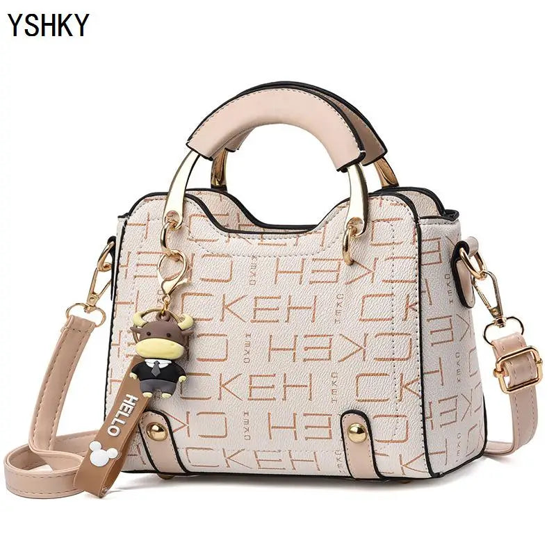 Women's PU Leather Handbag - Small Crossbody Purse with Cute Cow Charm & Multi-Pocket Interior - YSHKY