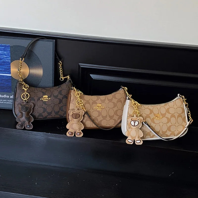 CLENLE Women's Vintage Monogram Shoulder Bag – Classic Canvas Crossbody Bag with Matching Bear Charm & Gold-Tone Chain